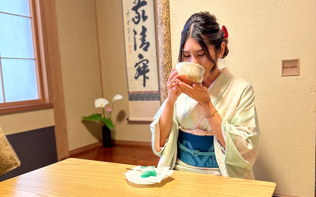 Kimono-clad person enjoying tea ceremony in Shinagawa, Tokyo.