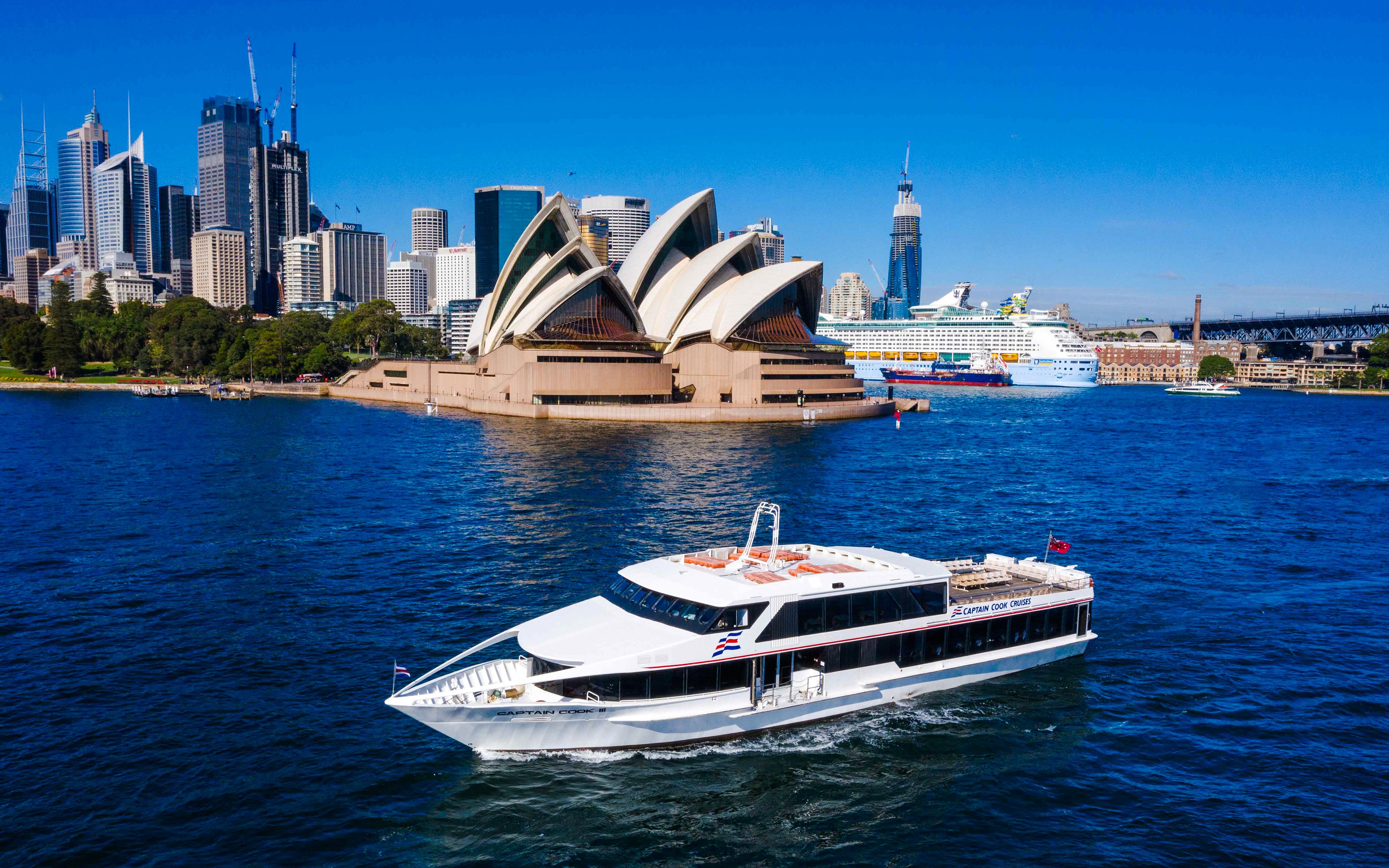 Cruise boat near Sydney Opera House during Vivid Sydney dinner cruise.