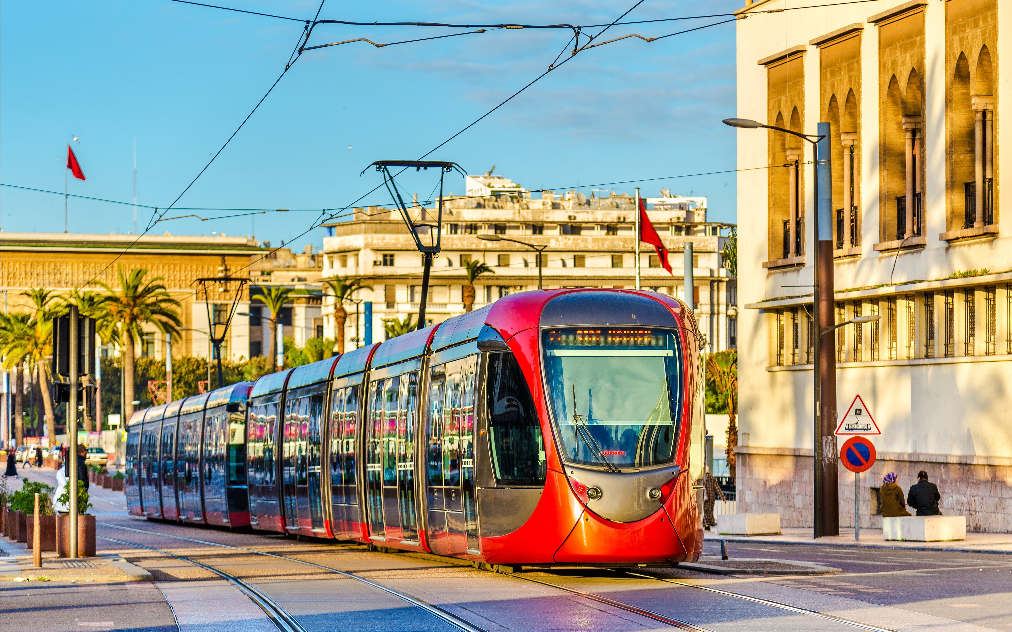 City tram traveling on a street in Casablanca, Morocco with buildings in the background.