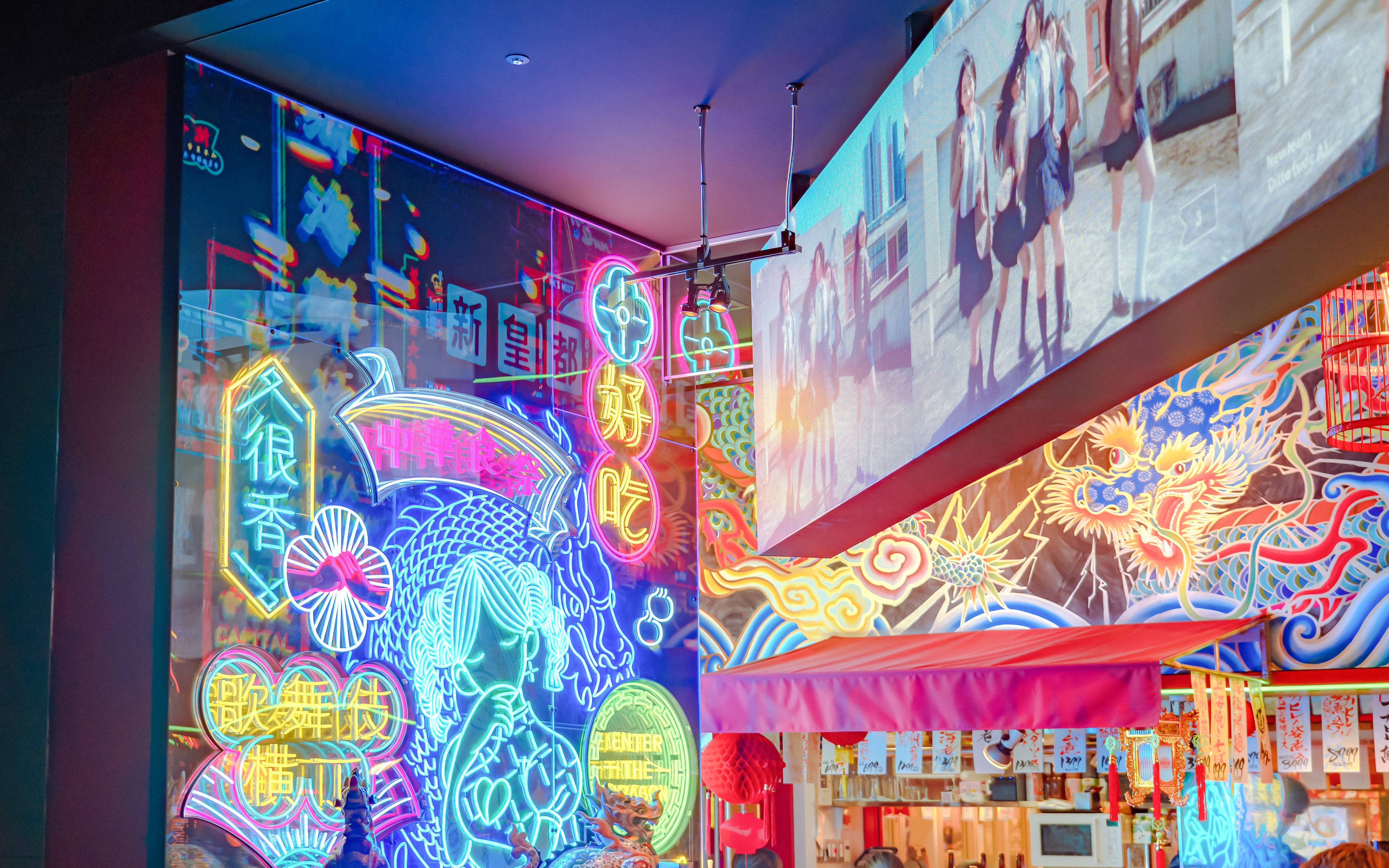 Neon lights and colorful signs in Tokyo's vibrant nightlife district.