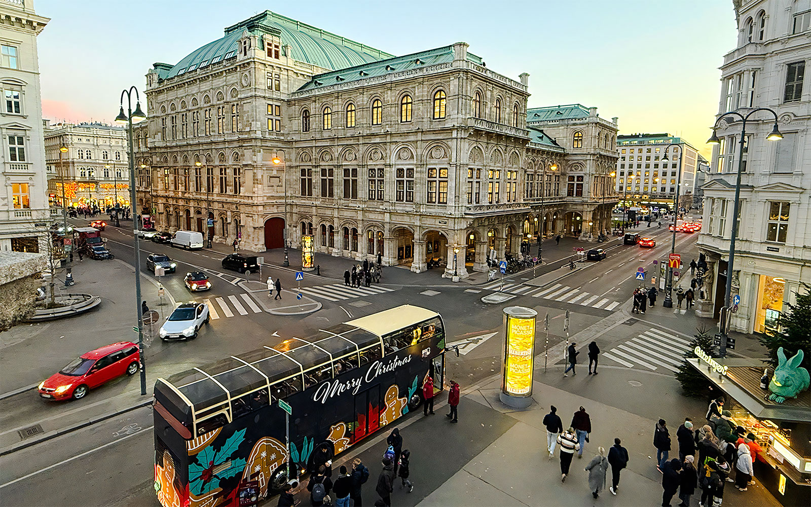 Big Bus HOHO decorated for Christmas in front of Vienna State Opera House.
