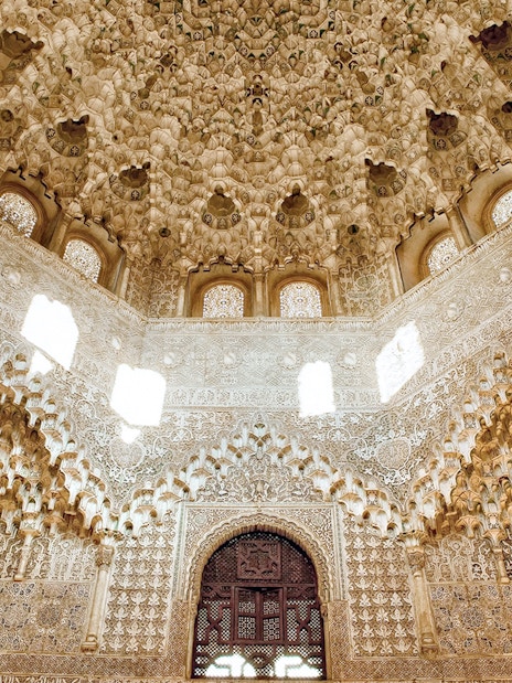 Intricate stucco ceiling and arches in the Nasrid Palace, Alhambra, Granada.