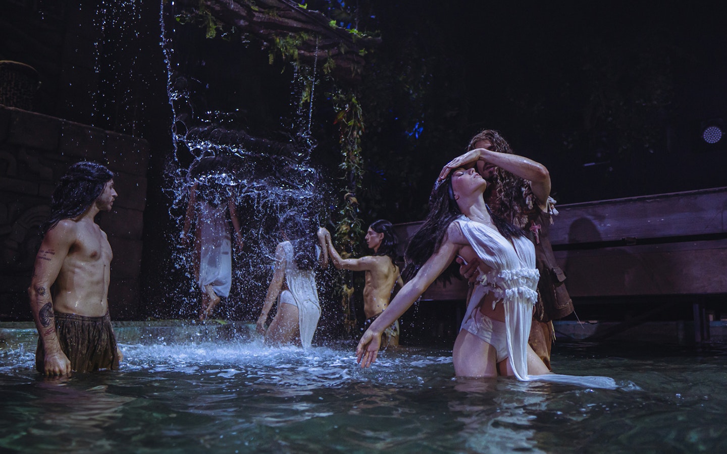 Performers in water scene from MALINCHE, un musical de Nacho Cano.