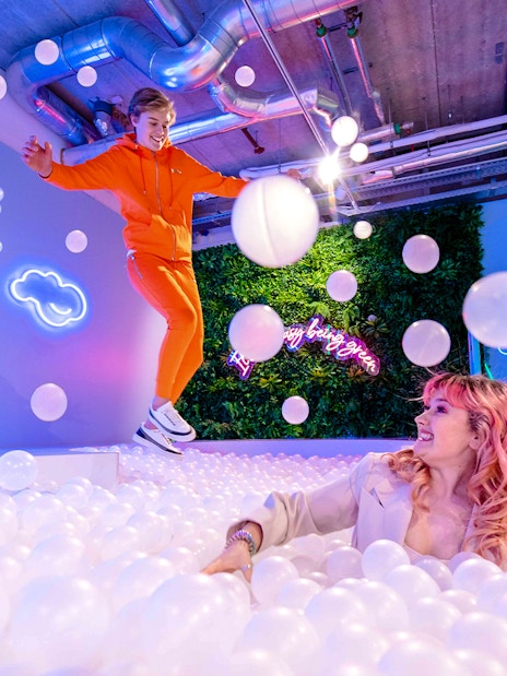 Visitors enjoying the ball pit at The Pool in Upside Down Amsterdam.
