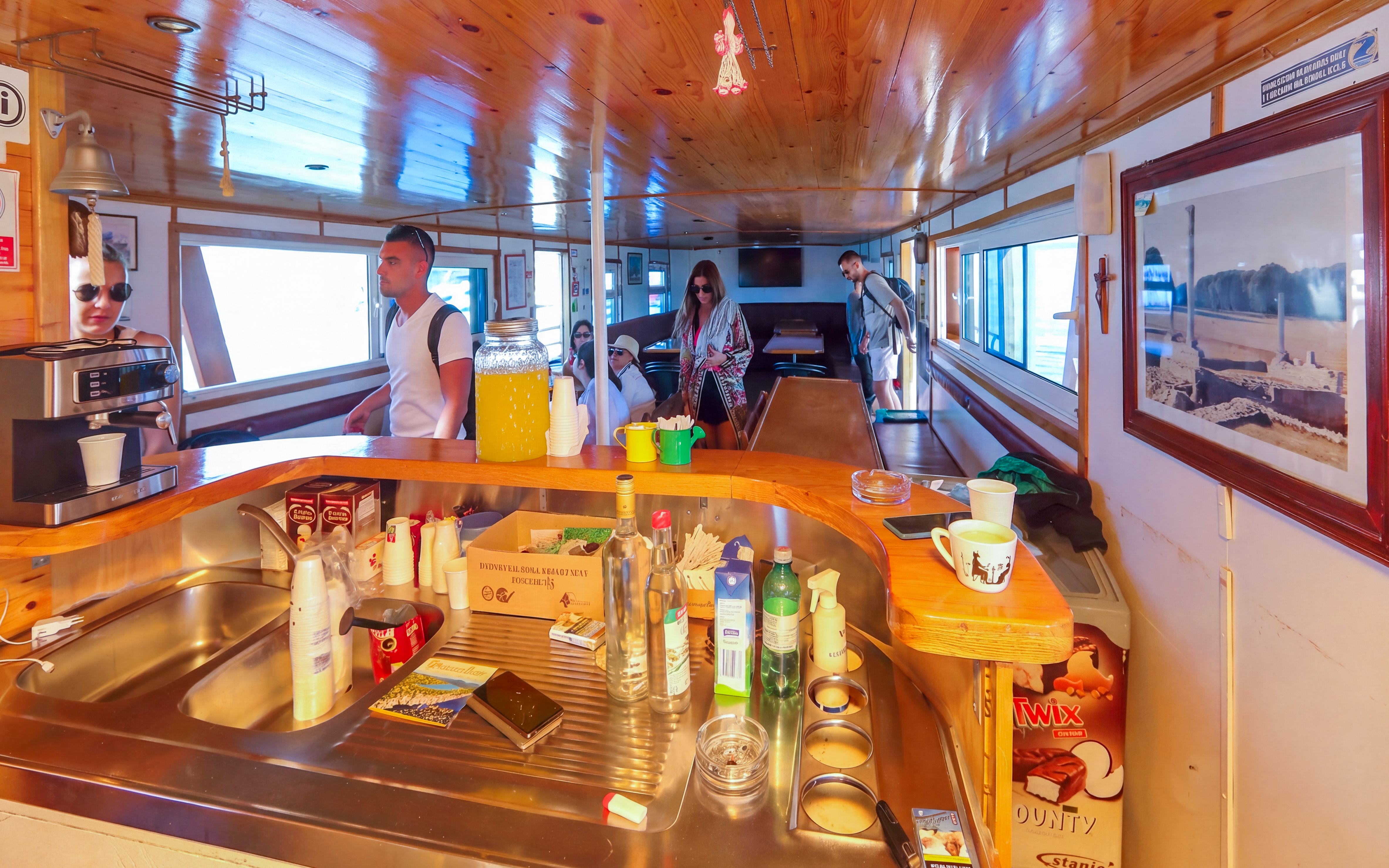Inside view of Franzka boat with passengers near bar area, Croatia.