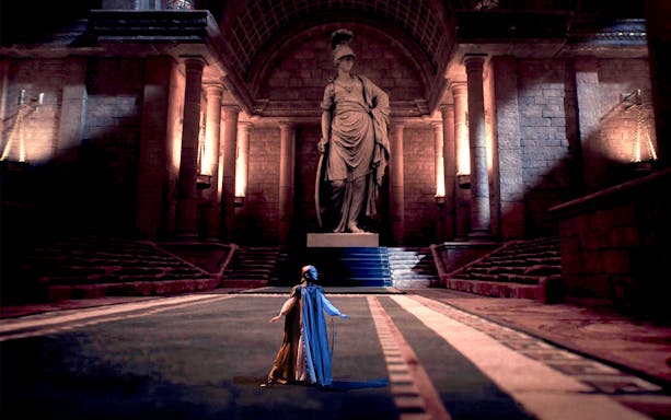Performers in historical attire at Legends of Istanbul show in grand hall.
