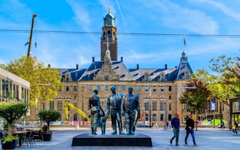 Rotterdam city hall with sculpture in front, part of Spy Hunt city exploration game.