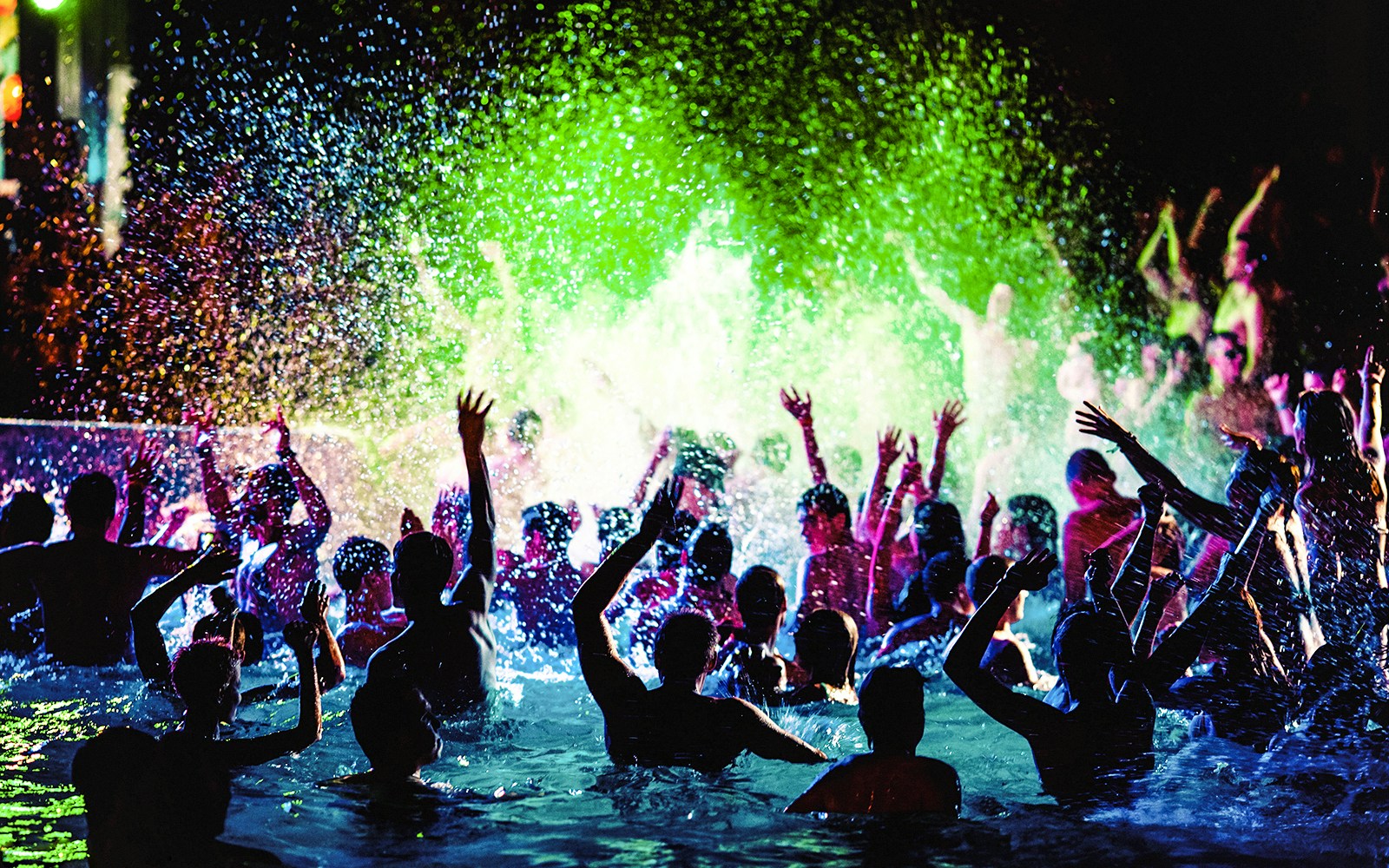 scene of people enjoying pool party at night