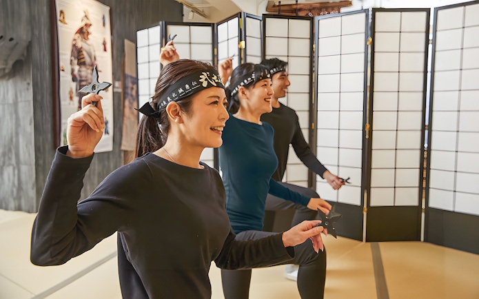 Participants practicing ninja star throwing at Samurai Ninja Museum Tokyo.