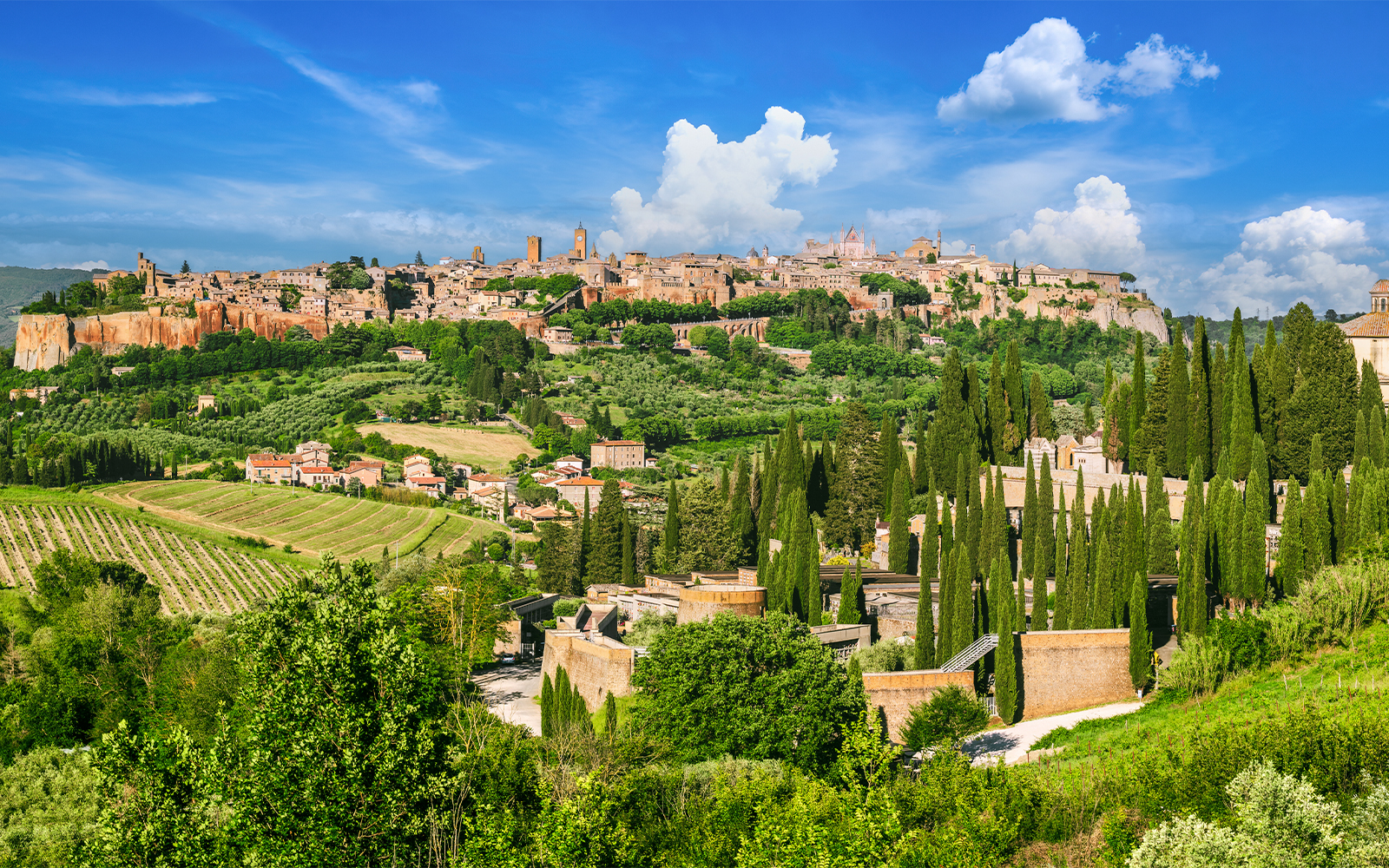 Orvieto's medieval walls and towers on a tuff hilltop in Italy.