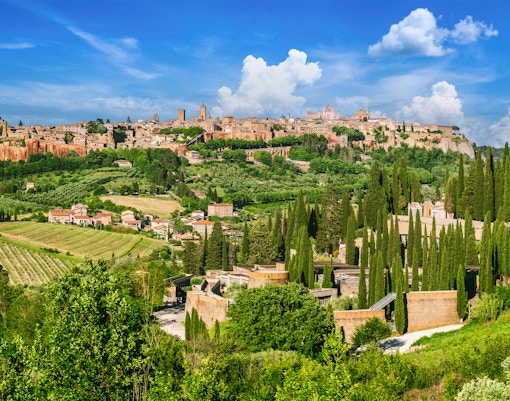 Orvieto's medieval walls and towers on a tuff hilltop in Italy.