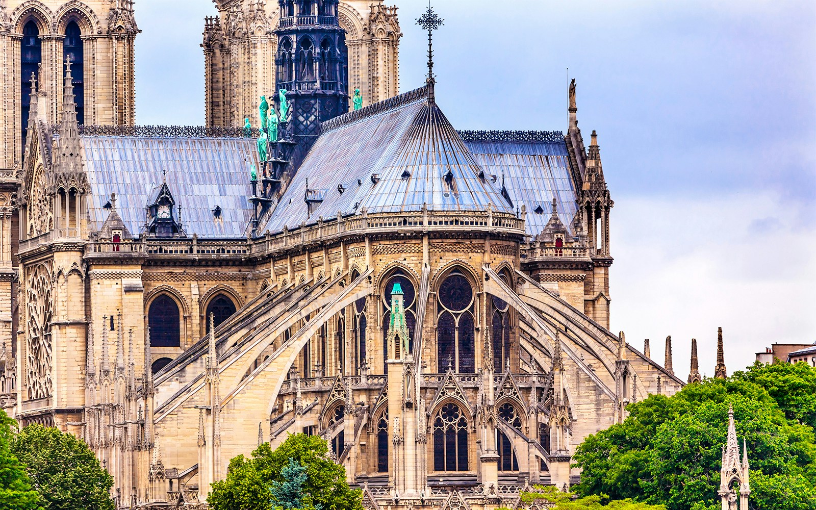 Notre-Dame Cathedral flying buttresses in Paris, showcasing Gothic architecture.