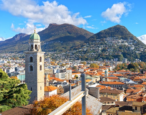 Panoramic view of Lugano with Lake Como and surrounding mountains from Milan day trip.