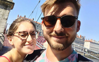 Couple on a bridge in Lyon Old Town during a self-guided city exploration game.
