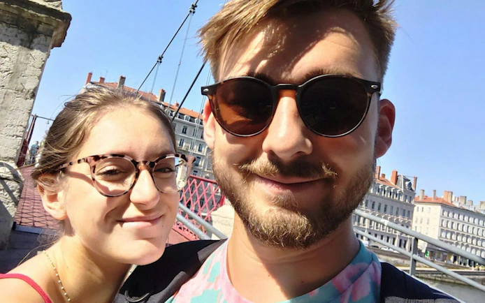 Couple on a bridge in Lyon Old Town during a self-guided city exploration game.