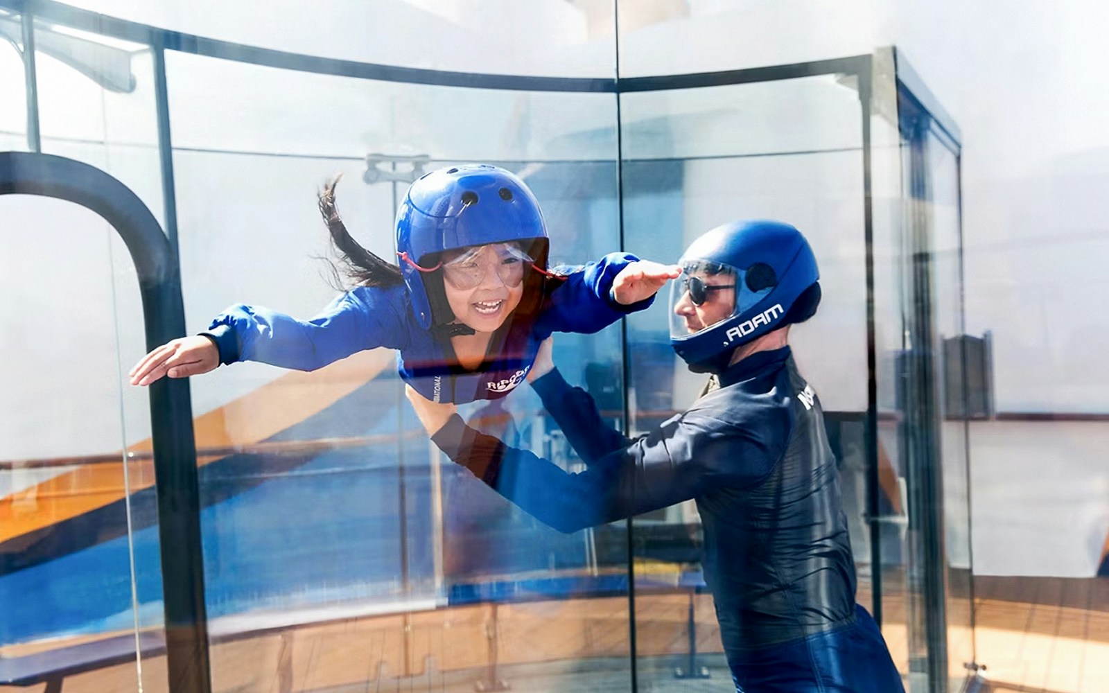 Tourists enjoying skydiving on the RipCord by iFly® simulator