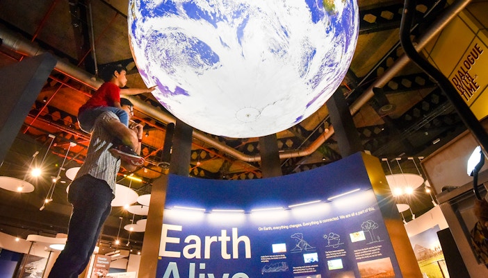Visitors exploring the interactive exhibits at the Science Centre Singapore, a popular destination for educational tours and family day trips