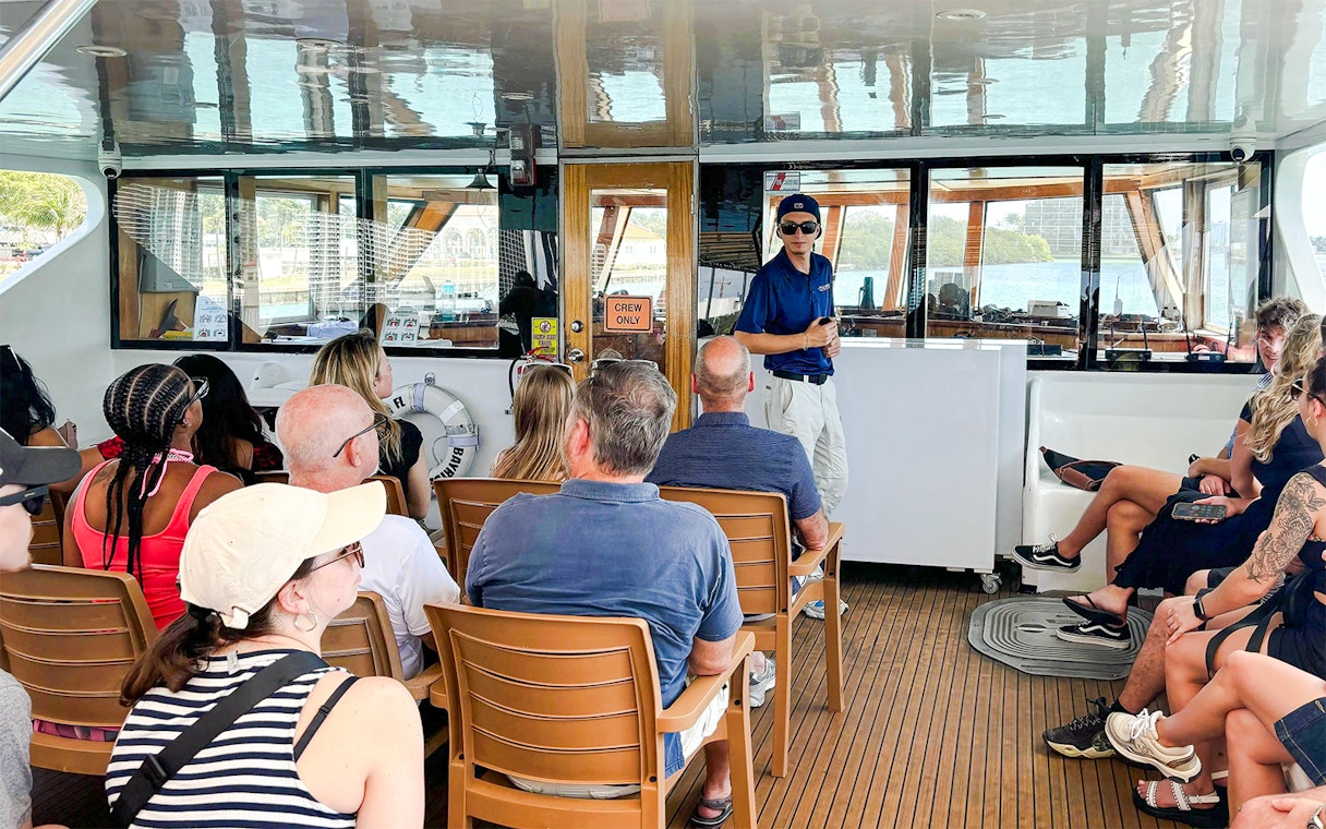 Guests listening to a guide on a cruise ship tour.