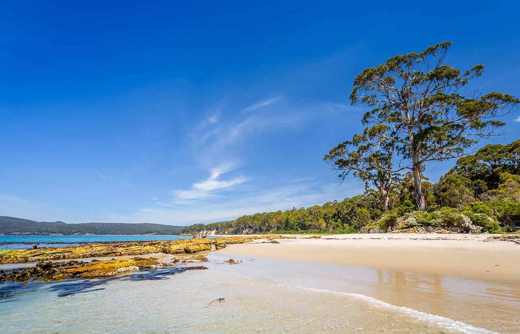 Great Bay beach with turquoise waters and sailboats in Philipsburg, Sint Maarten.