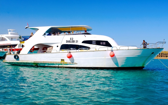 Speedboat tour in Dubai with passengers on deck.