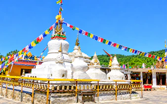 Stupas with prayer flags at Namobuddha Monastery, Bhaktapur.