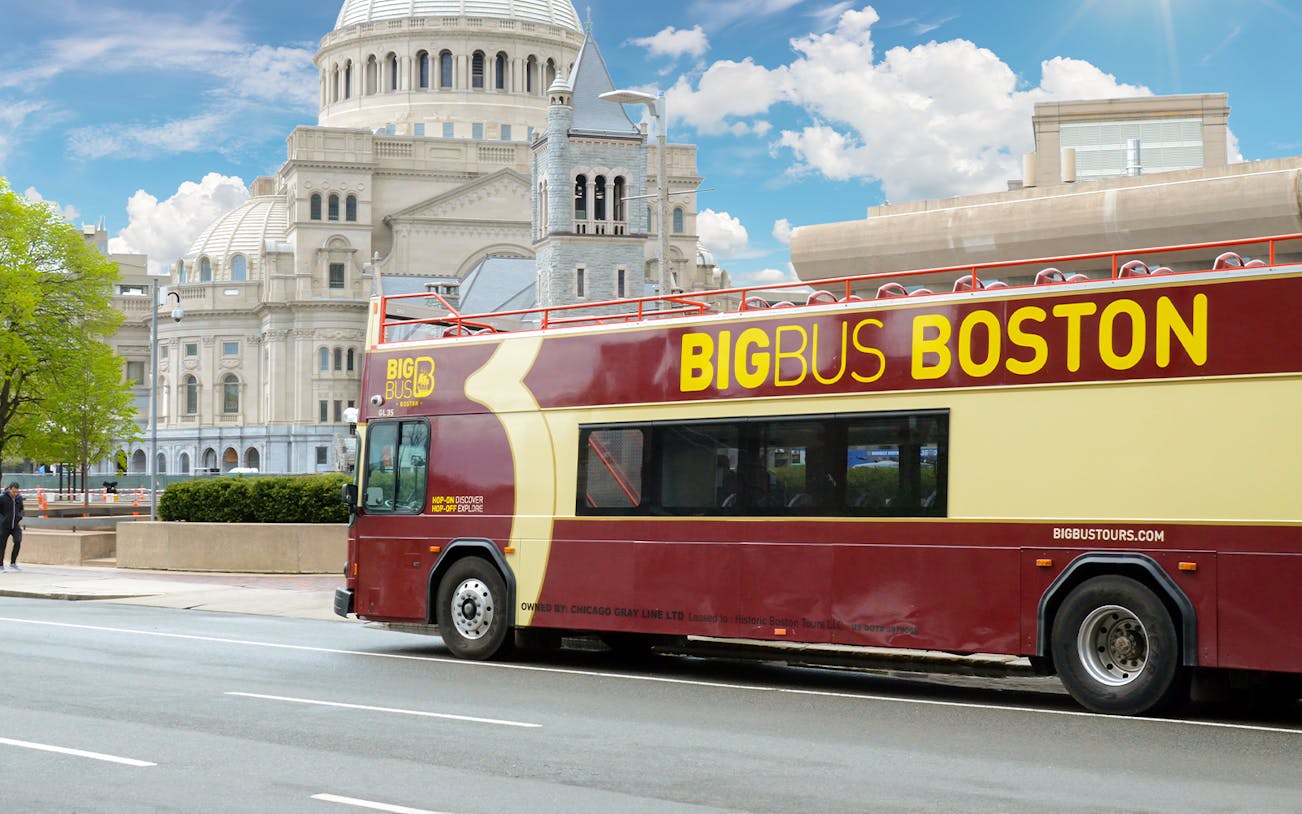 Hop-on hop-off bus in front of Boston's Christian Science Plaza.