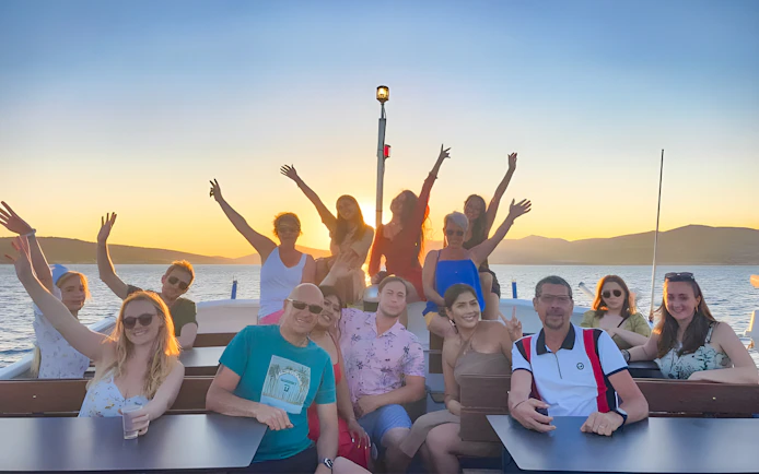 Group enjoying sunset on a boat during Split: Hvar & 3 islands cruise.