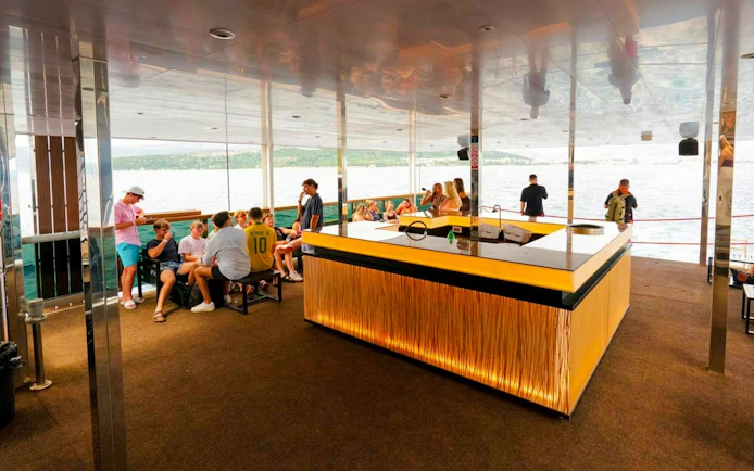 Guests socializing inside yacht during Blue Lagoon Yacht Party from Split.