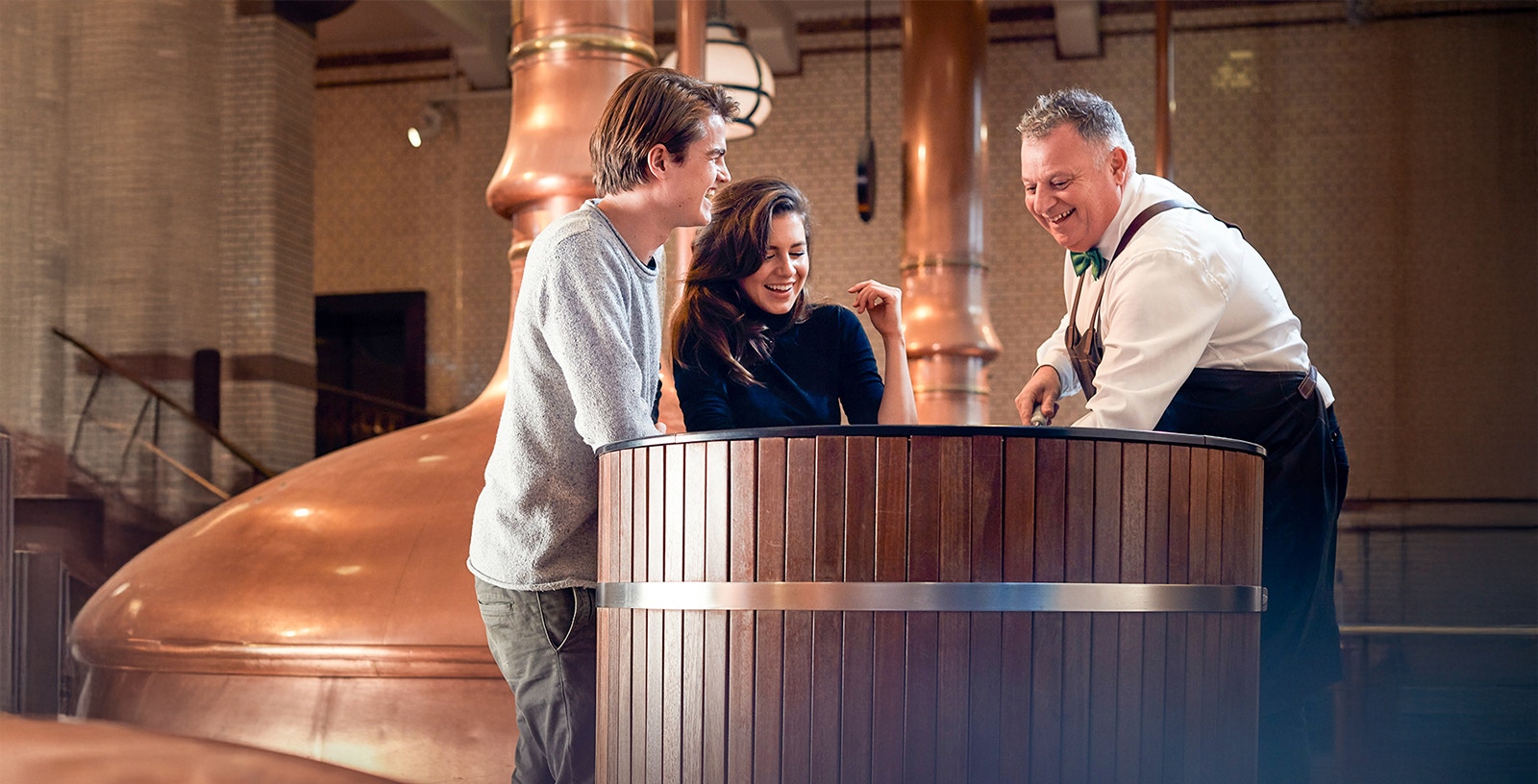 Visitors enjoying a tour at the Heineken Experience brewery in Amsterdam.