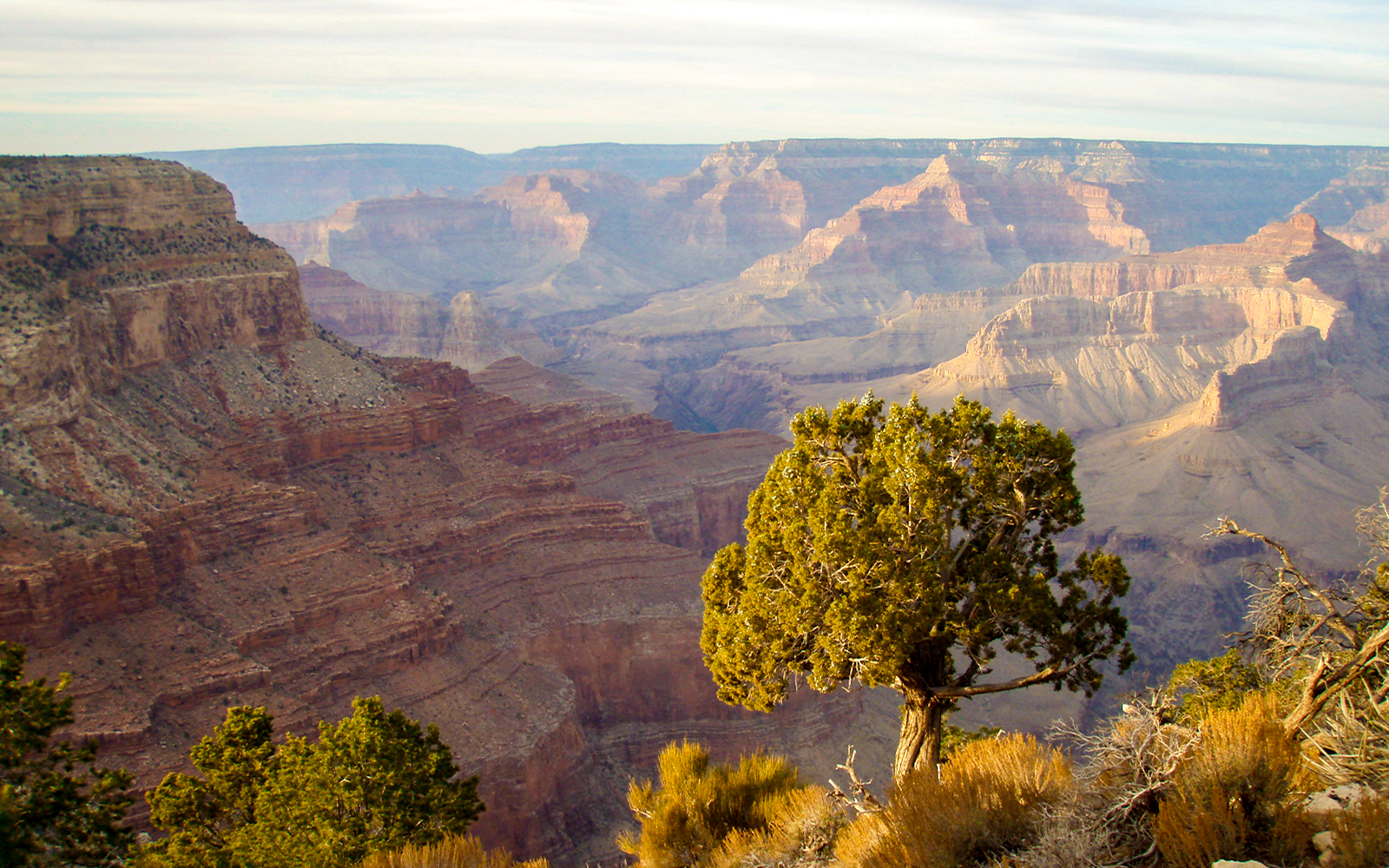 Grand Canyon Hermit's Rest viewpoint at sunset with vibrant sky.