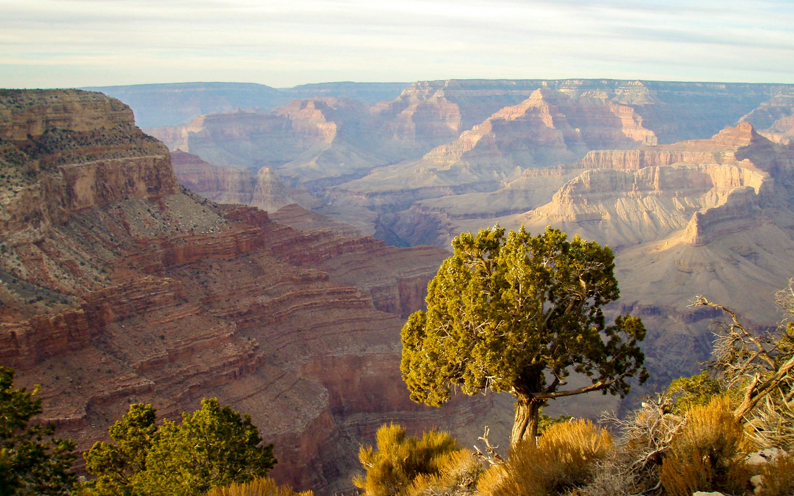 Grand Canyon Hermit's Rest viewpoint at sunset with vibrant sky.