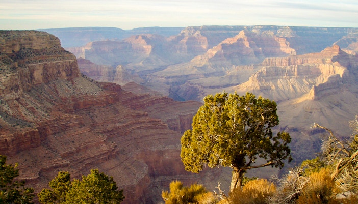 Grand Canyon Hermit's Rest viewpoint at sunset with vibrant sky.