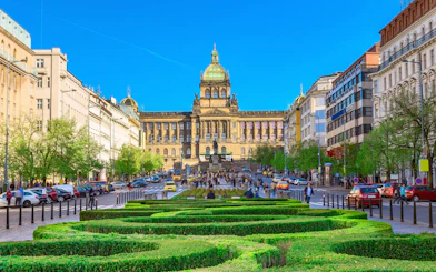 Wenceslas Square in Prague with National Museum and bustling street.