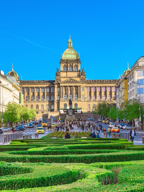 Wenceslas Square in Prague with National Museum and bustling street.