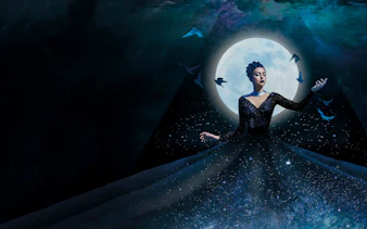 Opera performer in a starry dress with birds and full moon, The Magic Flute.
