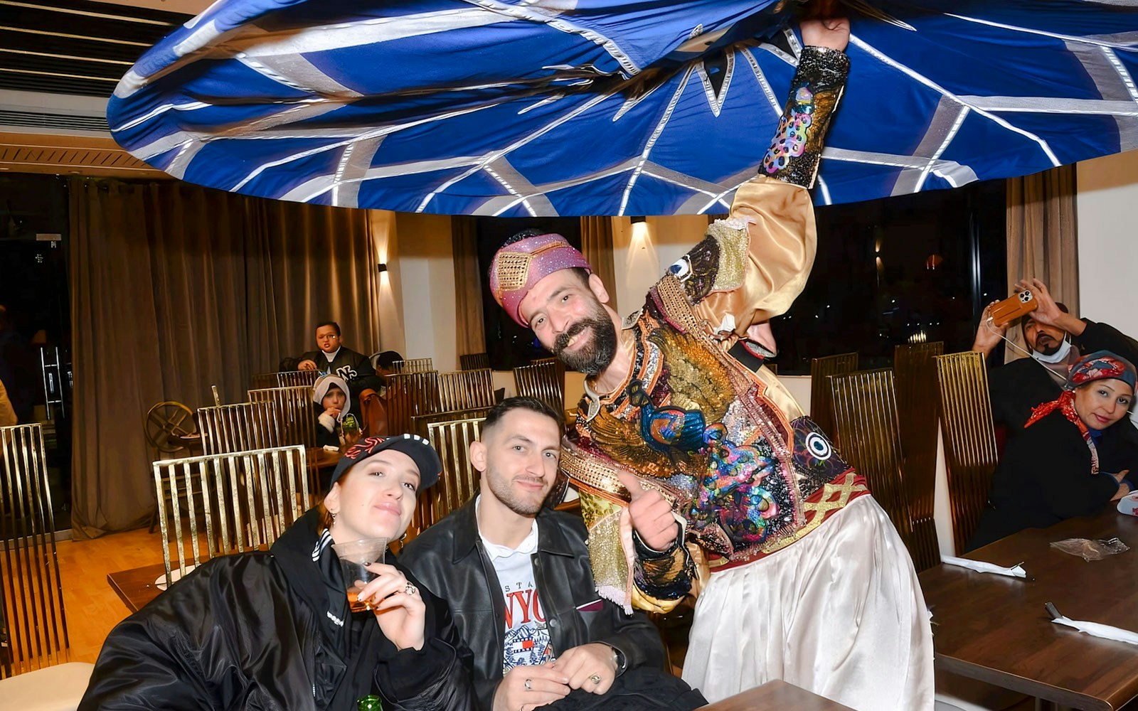 Guests with performer on Nile Dinner Cruise in Cairo.