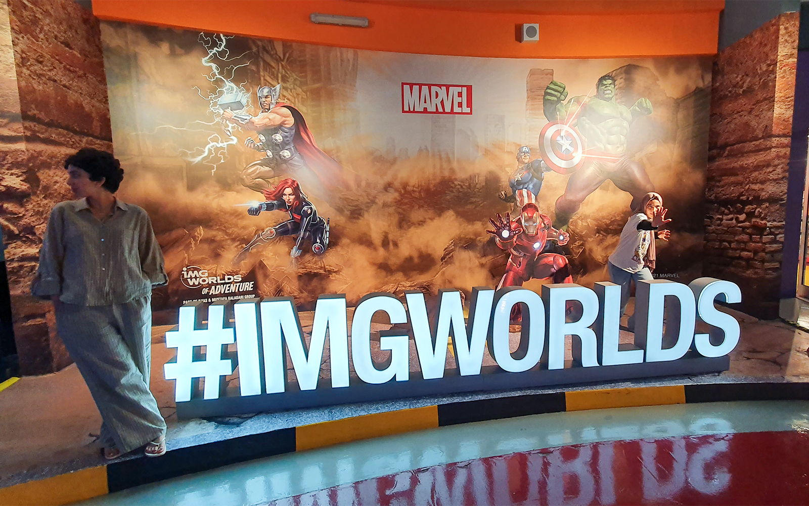 Thor Thunder Spin ride at IMG Worlds of Adventure, Dubai, with spinning seats and vibrant lights.