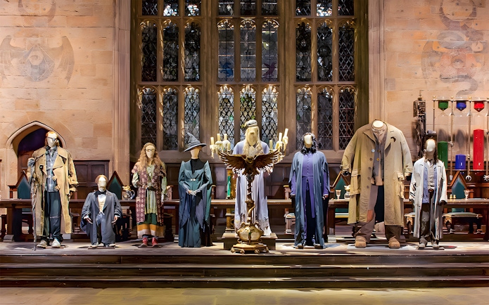Costumes from Harry Potter characters displayed at the London tour exhibit.