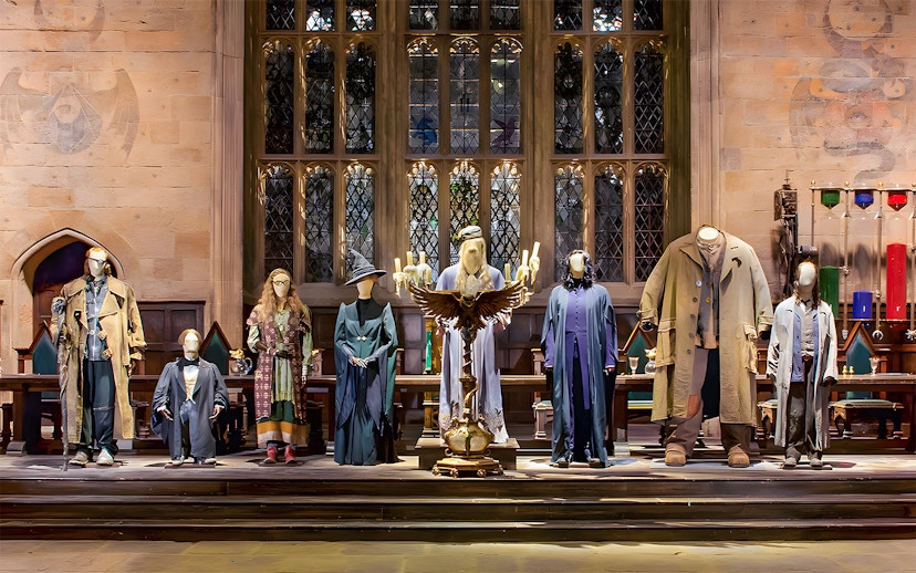 Costumes from Harry Potter characters displayed at the London tour exhibit.