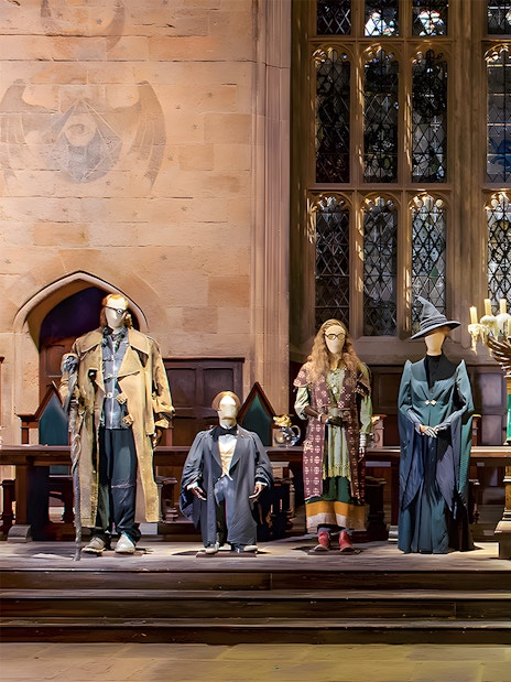 Costumes from Harry Potter characters displayed at the London tour exhibit.