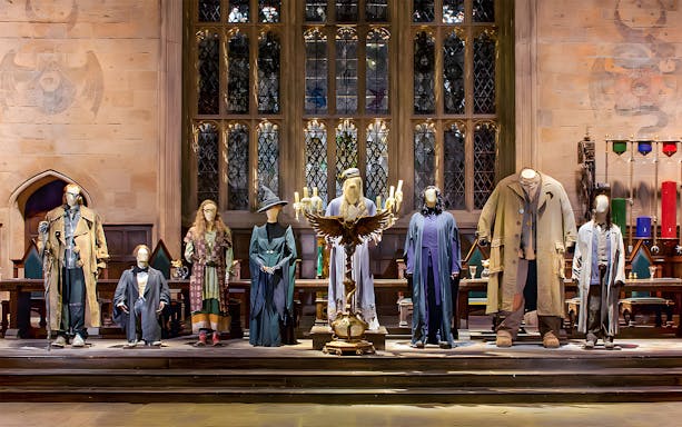Costumes from Harry Potter characters displayed at the London tour exhibit.