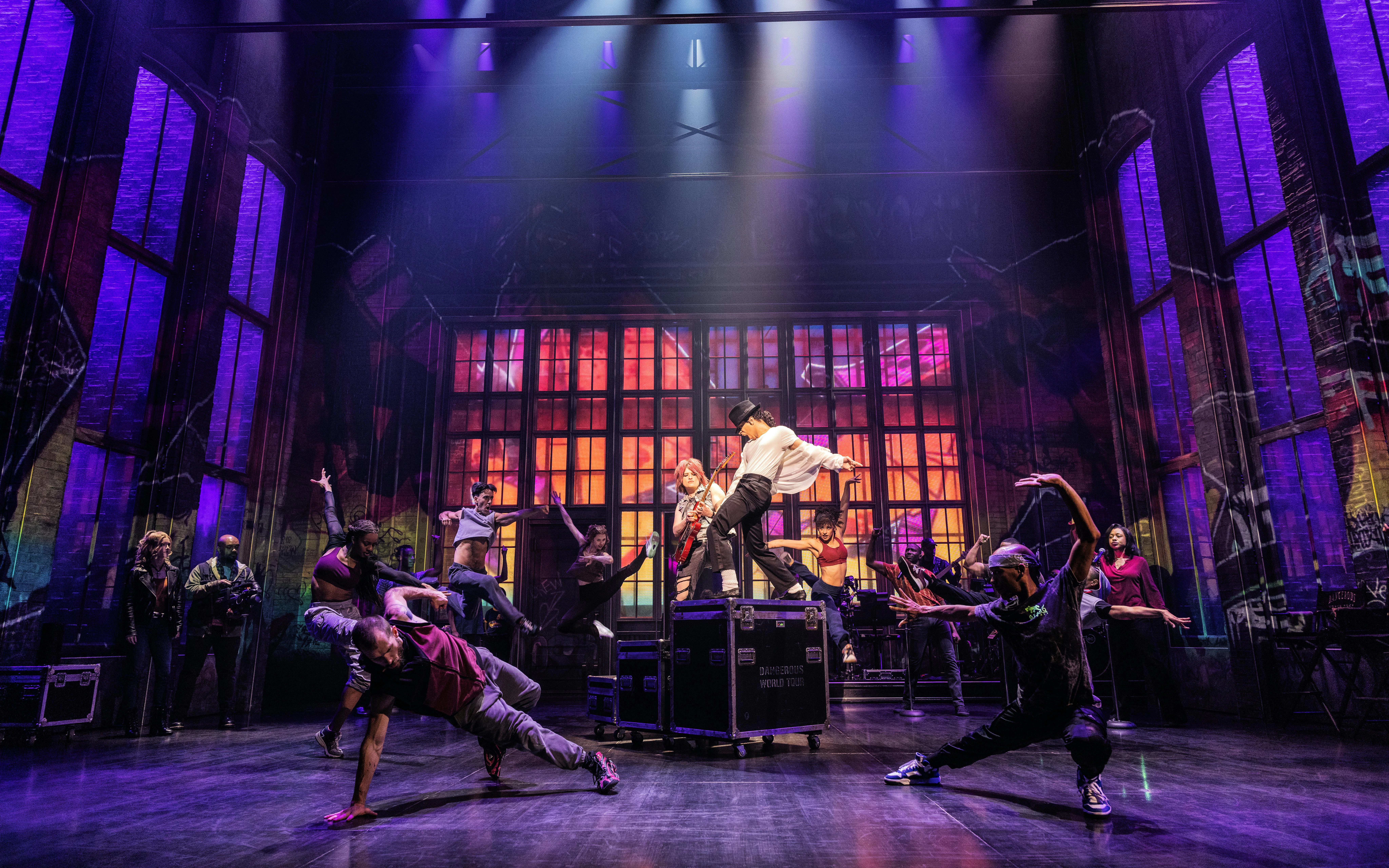Performers dancing energetically on stage during MJ the Musical on Broadway.