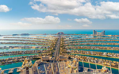 Aerial view of Palm Jumeirah in Dubai with Atlantis Hotel in the distance.