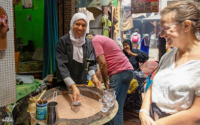 Vendor preparing tea in Marrakech souk near Ben Youssef Medersa and Le Jardin Secret.