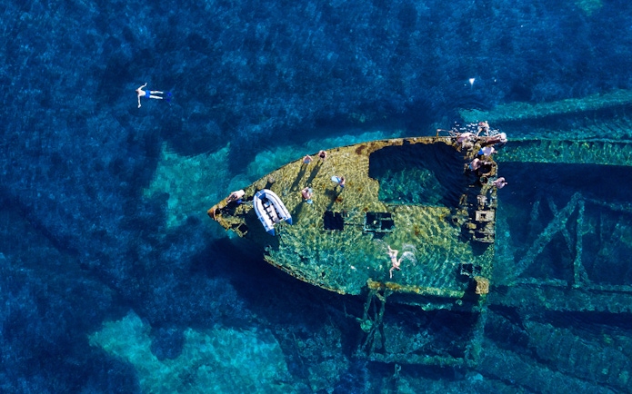 Swimming over the old wreck Michelle in the Adriatic Sea, Croatia.