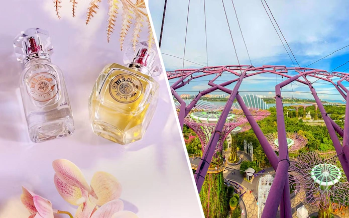 Perfume bottles with floral accents at Scentopia Sentosa, Singapore, with scenic view of Supertree Grove.
