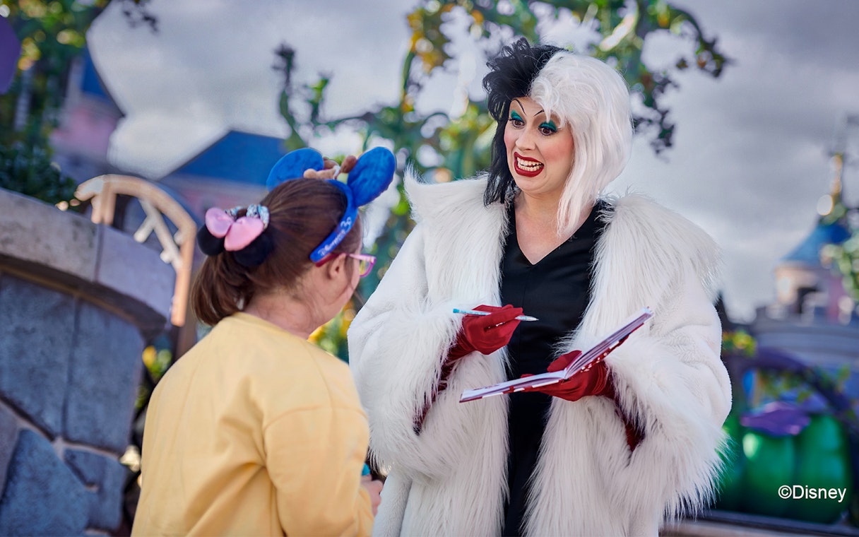 Character interaction at Disneyland Paris with a guest.