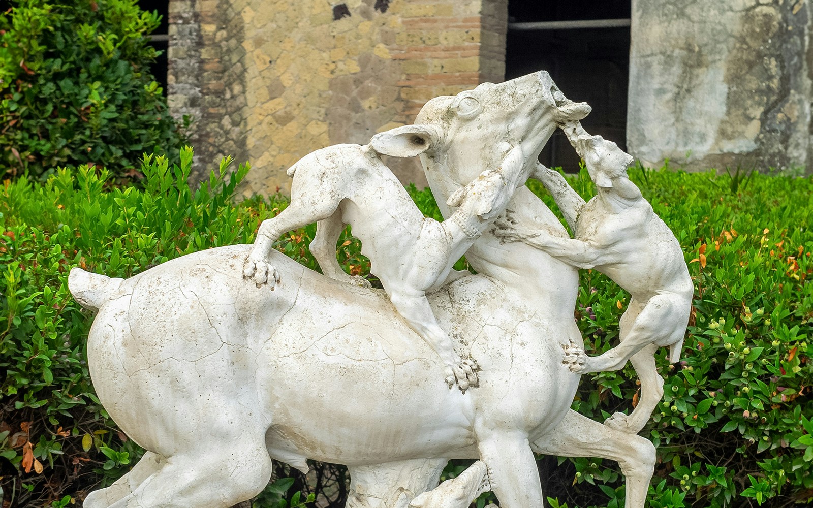 Statue of a deer attacked by dogs at House of the Deer, Herculaneum.