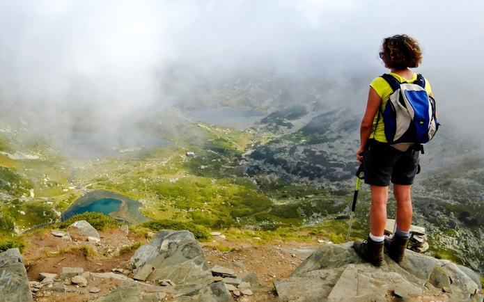 Hiker overlooking the Seven Rila Lakes during a tour from Sofia.