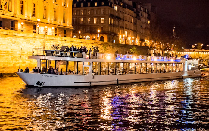Diamant Bleu dinner cruise on Seine River at night, Paris.